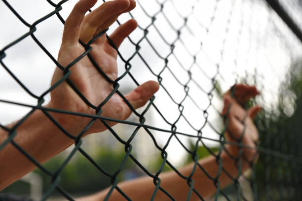 istock criminals and prisoners hands 979188216
