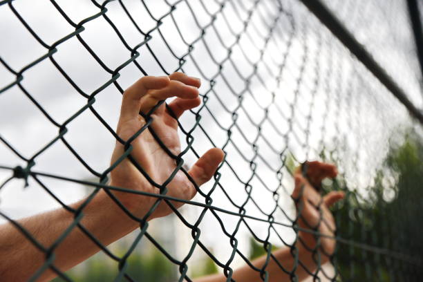 istock criminals and prisoners hands 979188218