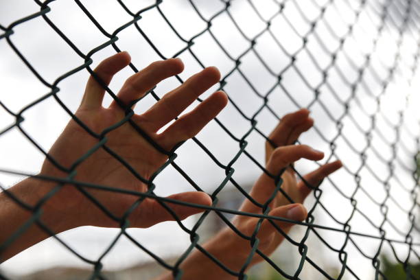 istock criminals and prisoners hands 979188220