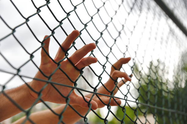 istock criminals and prisoners hands 979188222