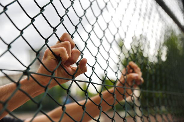 istock criminals and prisoners hands 979188224