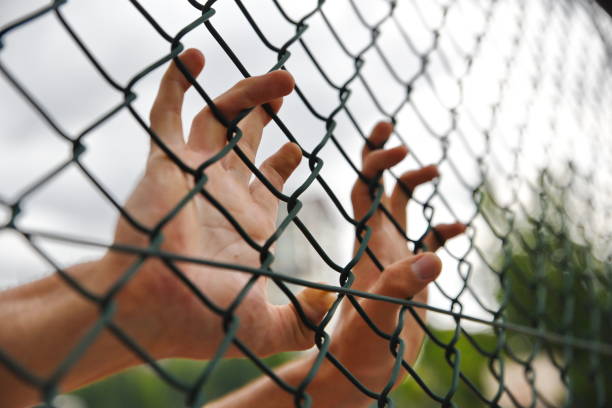 istock criminals and prisoners hands 979188226