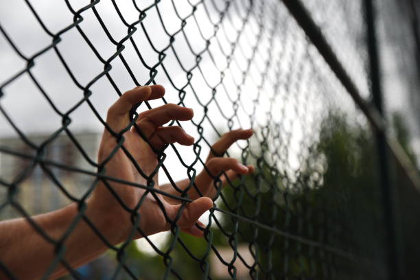 istock criminals and prisoners hands 979188236