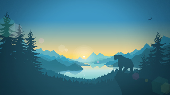 Wild natural landscape. The bear at dawn over a lake surrounded by mountains.