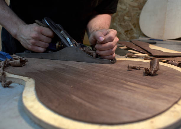 istock The guitar master scribbles back of the future classical guitar with a plane. 979198638