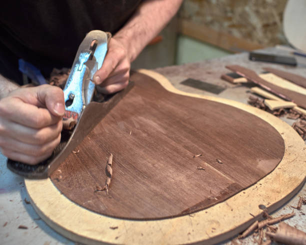 istock The guitar master scribbles back of the future classical guitar with a plane. 979198678