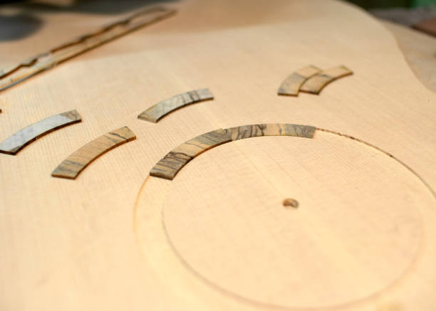 istock The guitar master pastes the rosette into a classical guitar. 979198696