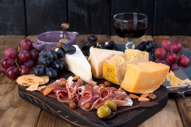 istock Different Dutch cheese. Ham, grapes, olives and snacks. Free space for text. copy space 979199250