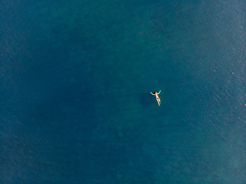 Aerial view of swimming woman