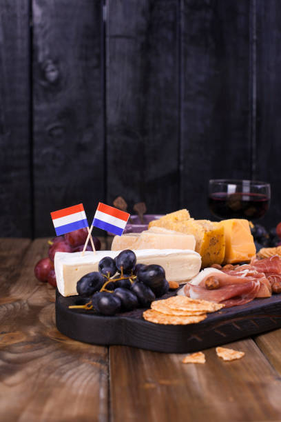 istock Different Dutch cheese. Ham, grapes, olives and snacks. Free space for text. copy space 979199862