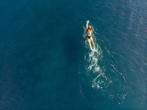 Aerial view of swimming woman