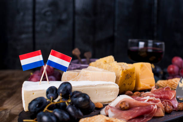istock Different Dutch cheese. Ham, grapes, olives and snacks. Free space for text. copy space 979200258