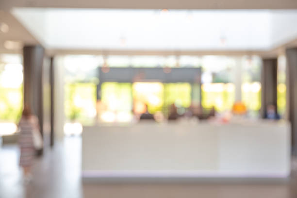 istock Abstract blurred image of people waiting for room registration at reception counter or front desk. 979200468