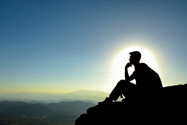 istock man silhouette watching the awesome scenes 979200766