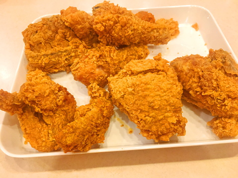 Crispy kentucky fried chicken  in dish,on A White Background.