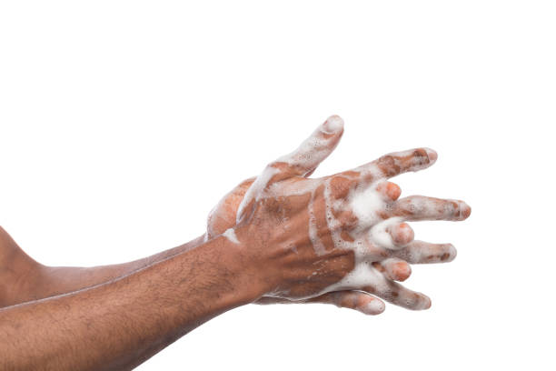 istock Black man washing hands isolated on white background 979204300