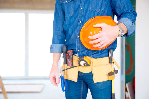 istock Handyman with handyman belt and safety helmet 979204448