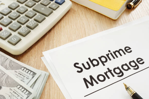 istock Subprime mortgage form, calculator and pen. 979210206