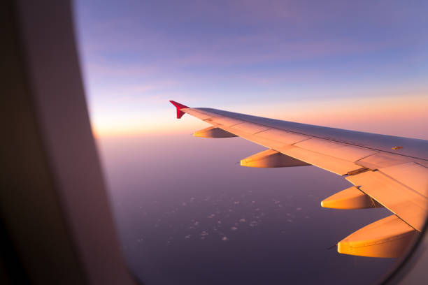 istock Clouds and sky sunny day through airplane window 979210602