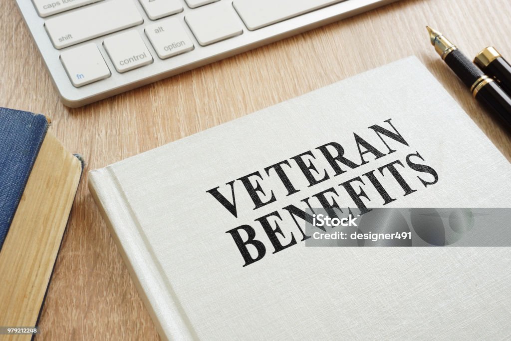 Book about Veteran Benefits on a desk. Veteran Stock Photo