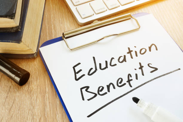 istock Clipboard with words Education Benefits written by hand. 979212574