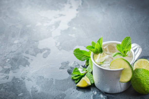 istock Moscow mule cocktail with vodka, ginger beer, lime and mint 979213442
