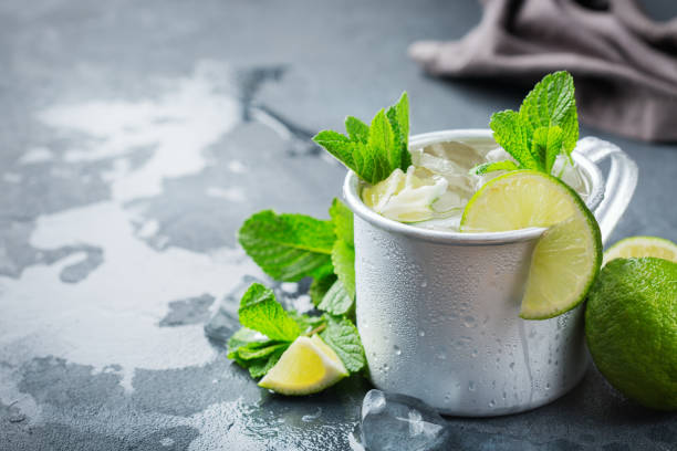 istock Moscow mule cocktail with vodka, ginger beer, lime and mint 979213534