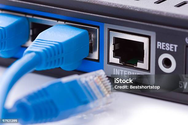 Closeup Of Wires Plugged Into Modem With One Disconnected Stock Photo - Download Image Now