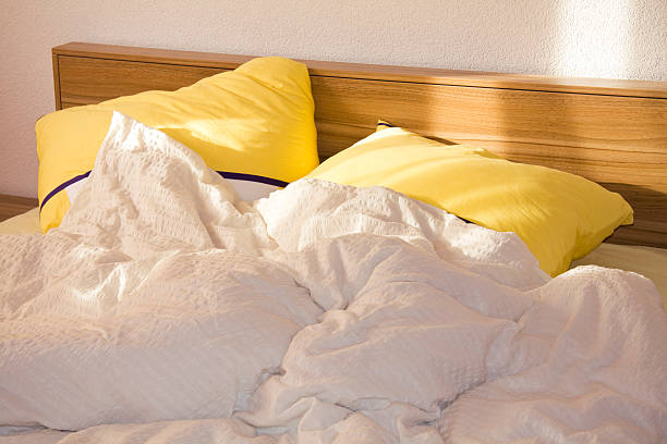 istock unmade bed in the morning 97921417