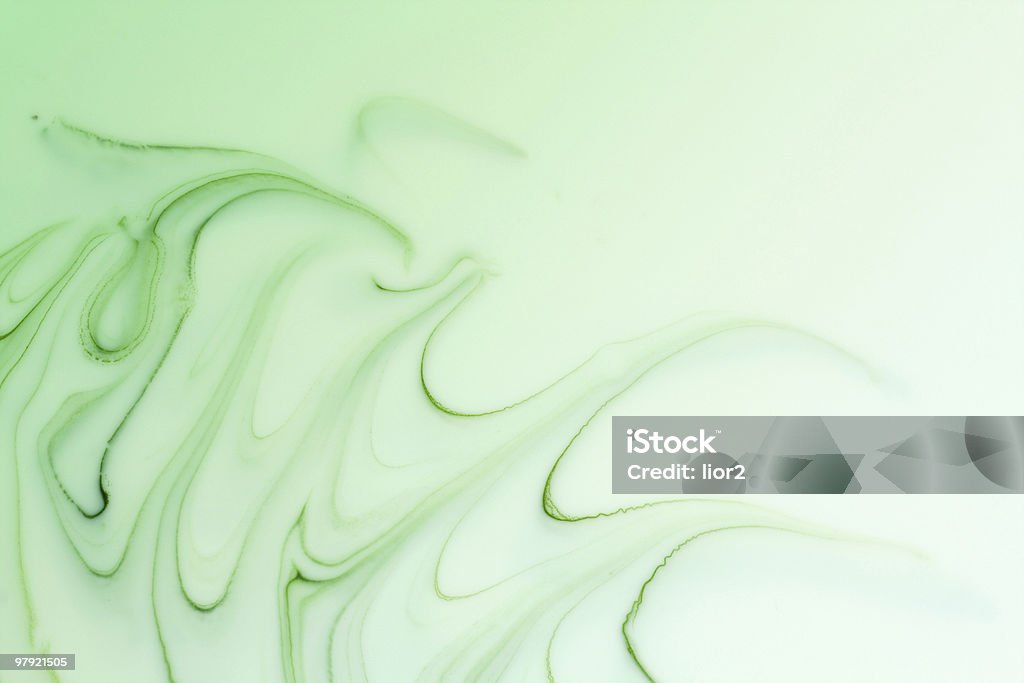 Mix of a white and green paint Mix of a white and green paint, closeup Abstract Stock Photo