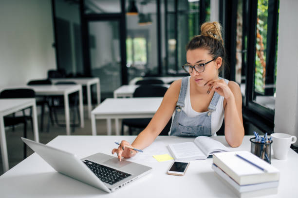 istock Student girl doing online research. 979224808