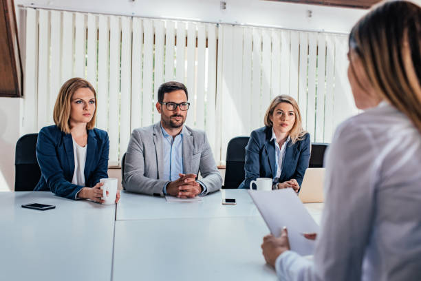 istock Job interview with three serious business persons. 979229998