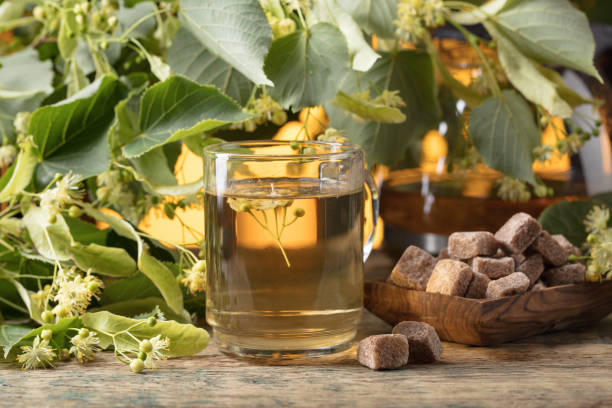 istock Glass of linden tea with brown sugar . 979230254
