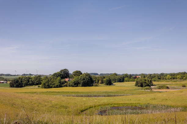 istock Farm buildings with fields and living hedges 979230502