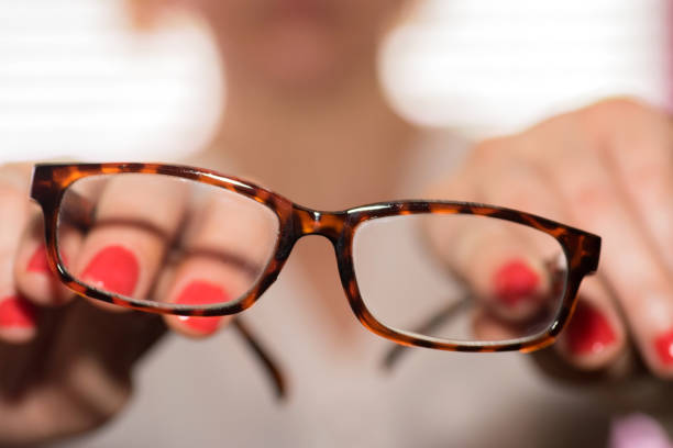 istock A woman holds glasses in her hands 979233432