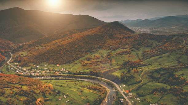 istock Aerial View: autumn canyon village along the river 979235302