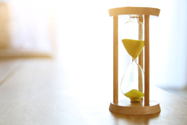 istock Hourglass as time passing concept for business deadline. 979237636