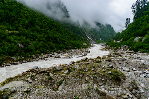 Mountain river flowing through himalayan mountain valley
