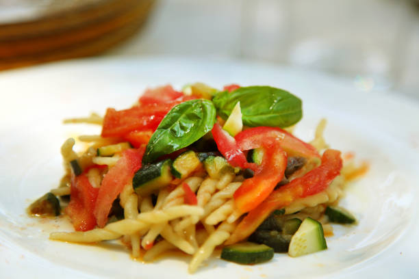 istock trofie pasta with tomatoes and zucchini 979248392