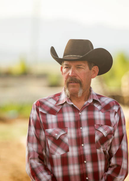 istock Cowboy male with hat standing at Utah 979264066