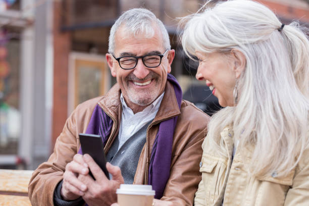 istock Handsome senior man uses smart phone 979269068