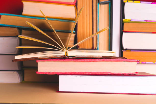 istock Open book, hardback books on bright colorful background. 979269260