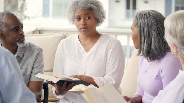 istock Serious senior woman discusses something during Bible study 979269350