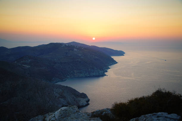 Sunset view from a hill above Chora on North East coast of Folegandros island, Greece.