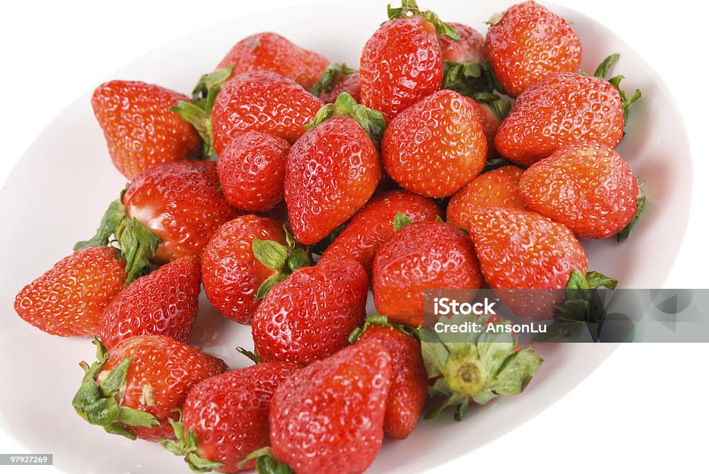Isolated pile strawberry in white dish  Beauty In Nature Stock Photo