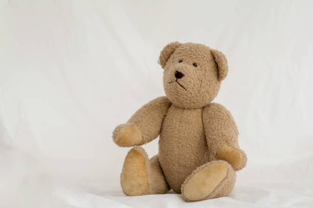 istock Brown toy teddy bear  sitting on white background. 979276016