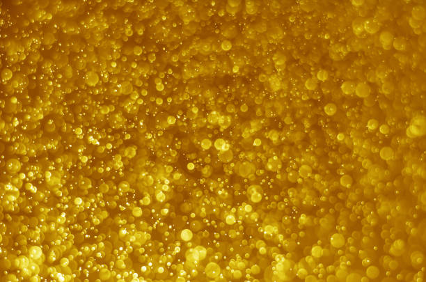 istock abstract yellow bokeh glitter sparkle background. 979281190