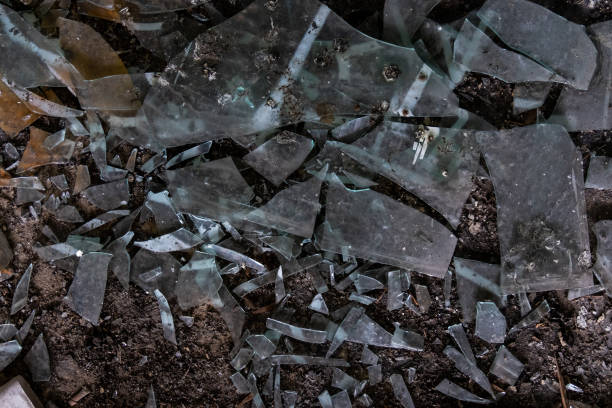 istock Broken glass on floor background, top view 979300742