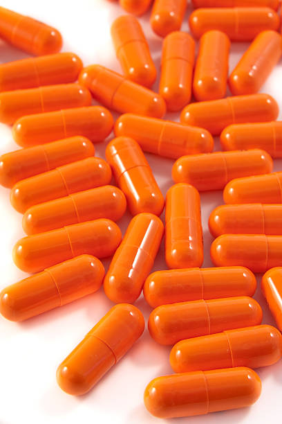 istock bunch of orange pills 97931578