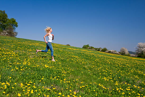 istock happy young woman on meadow 97931745